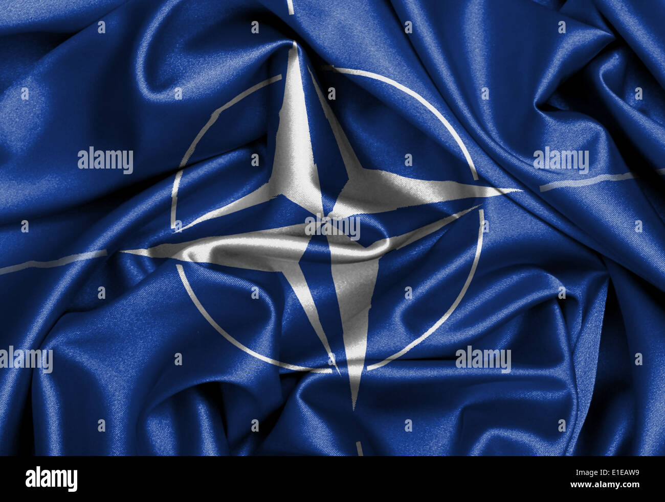 Satin flag with emblem, NATO symbol closeup Stock Photo Alamy