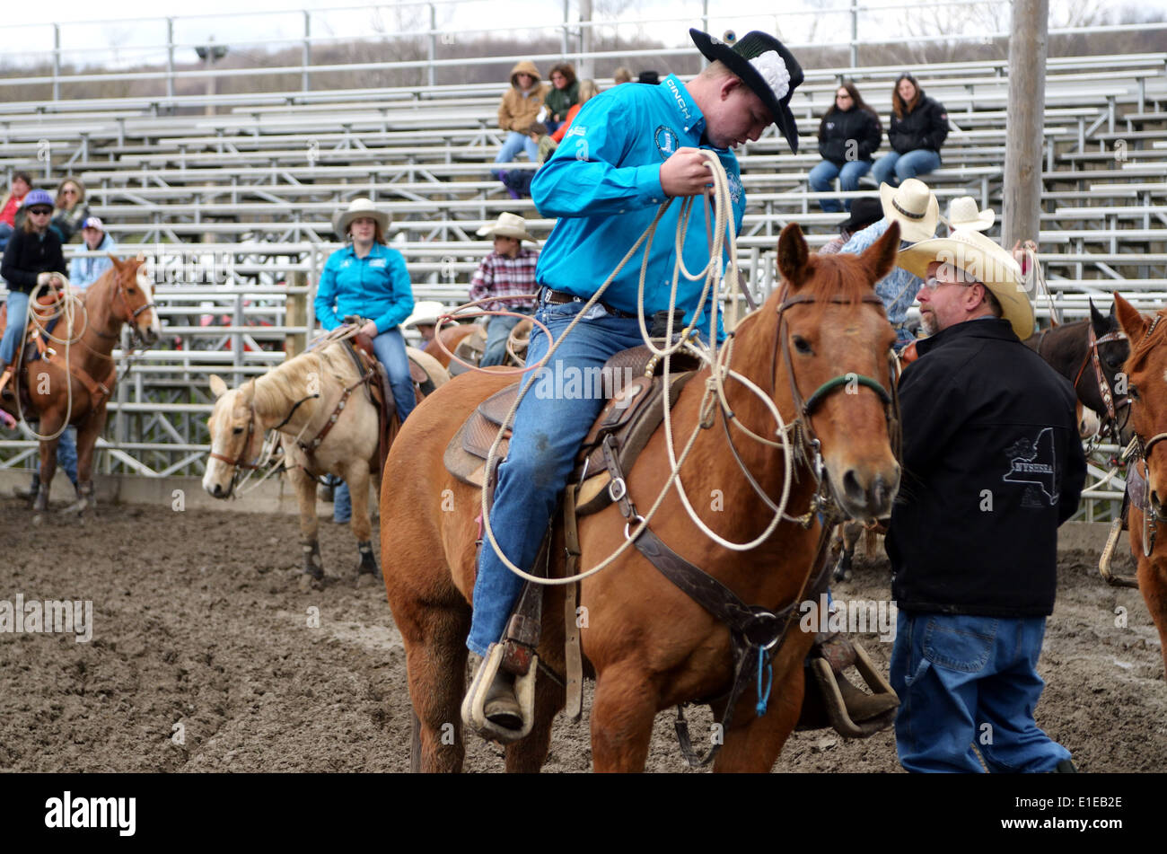 high school rodeo competitor takes his position in calf roping. Stock Photo