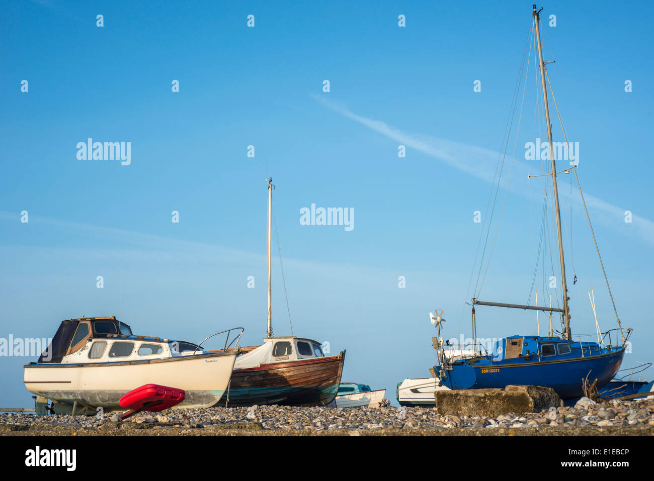 Boats on the beach at Lyme Regis, Dorset, England, UK Stock Photo