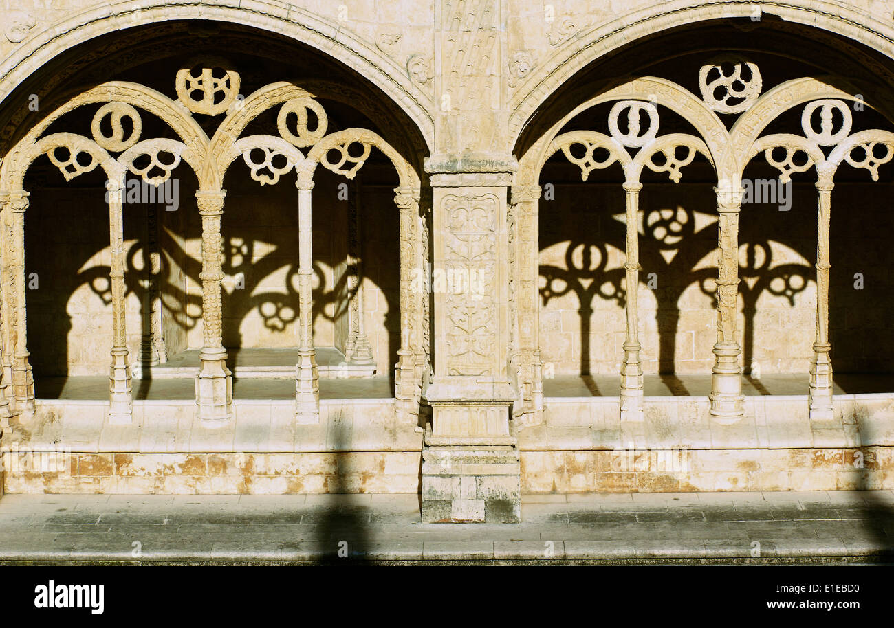 Mosteiro dos Jeronimos cloister UNESCO world heritage site ornate arches and carvings with shadows Belem Lisbon Portugal Europe Stock Photo