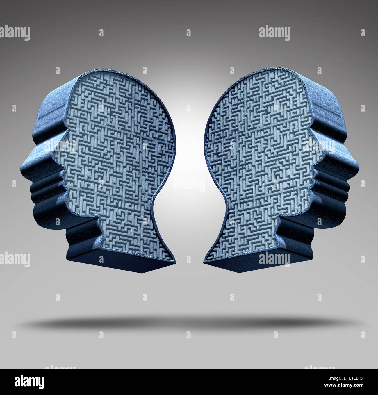 Bipolar disorder concept as a human head divided in two pieces with a maze or labyrinth inside as a mental health care symbol and medical psychological metaphor for the social behavior challenges of the disease. Stock Photo