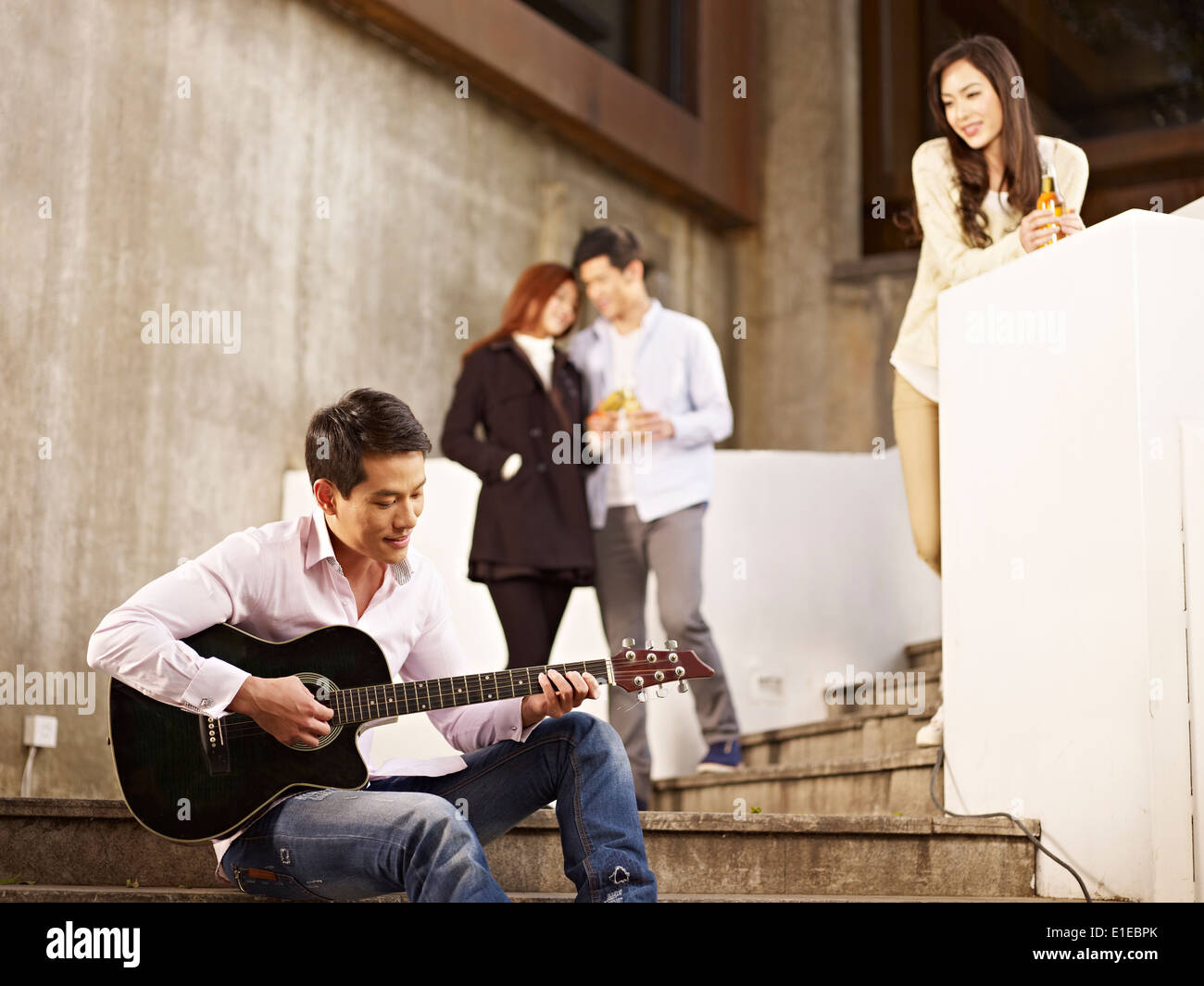 young asian hanging out on the street Stock Photo Alamy