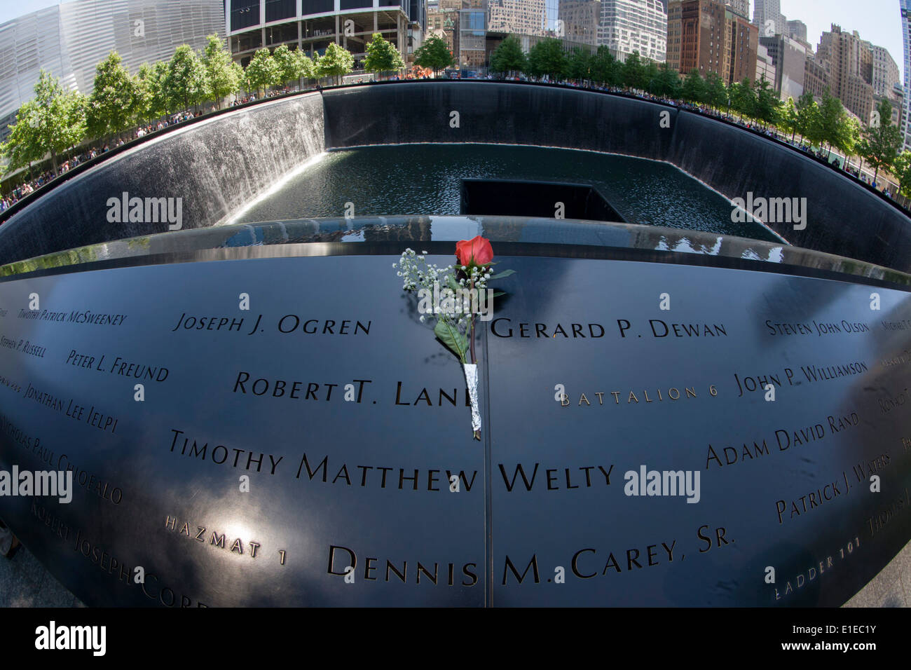 Distorted by fish-eye lens, names of victims at the 9/11 Memorial in New York, killed at the locations of terrorist attacks on September 11th 2001. The National September 11 Memorial is a tribute of remembrance and honor to the nearly 3,000 people killed in the terror attacks of September 11, 2001 at the World Trade Center site, near Shanksville, Pa., and at the Pentagon, as well as the six people killed in the World Trade Center bombing in February 1993. Stock Photo