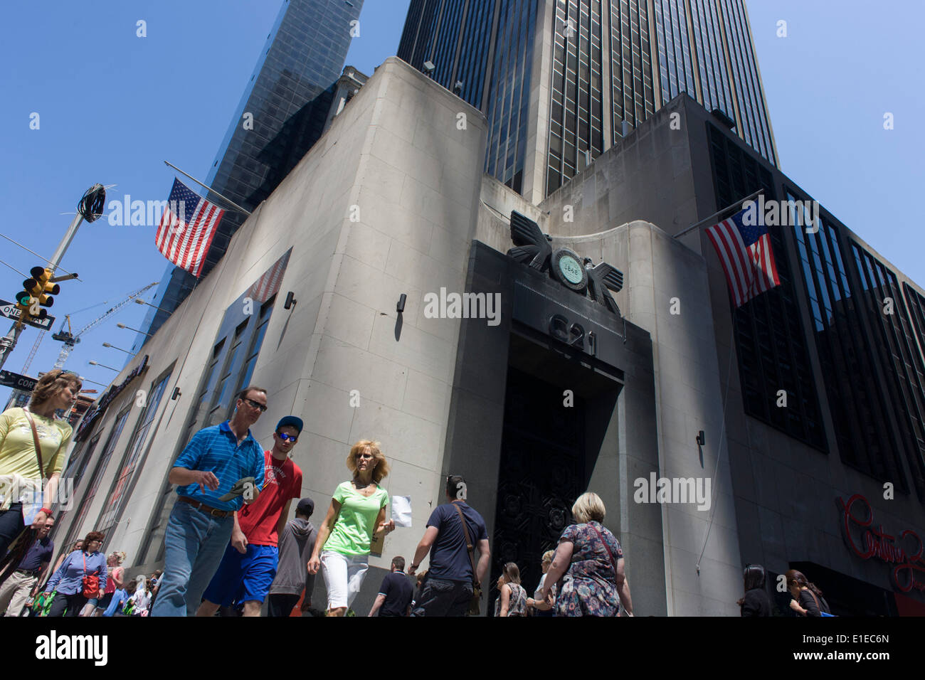 American consumers pass the tall doorway of the East River Savings Bank in Lower Manhattan, New York City. Stock Photo