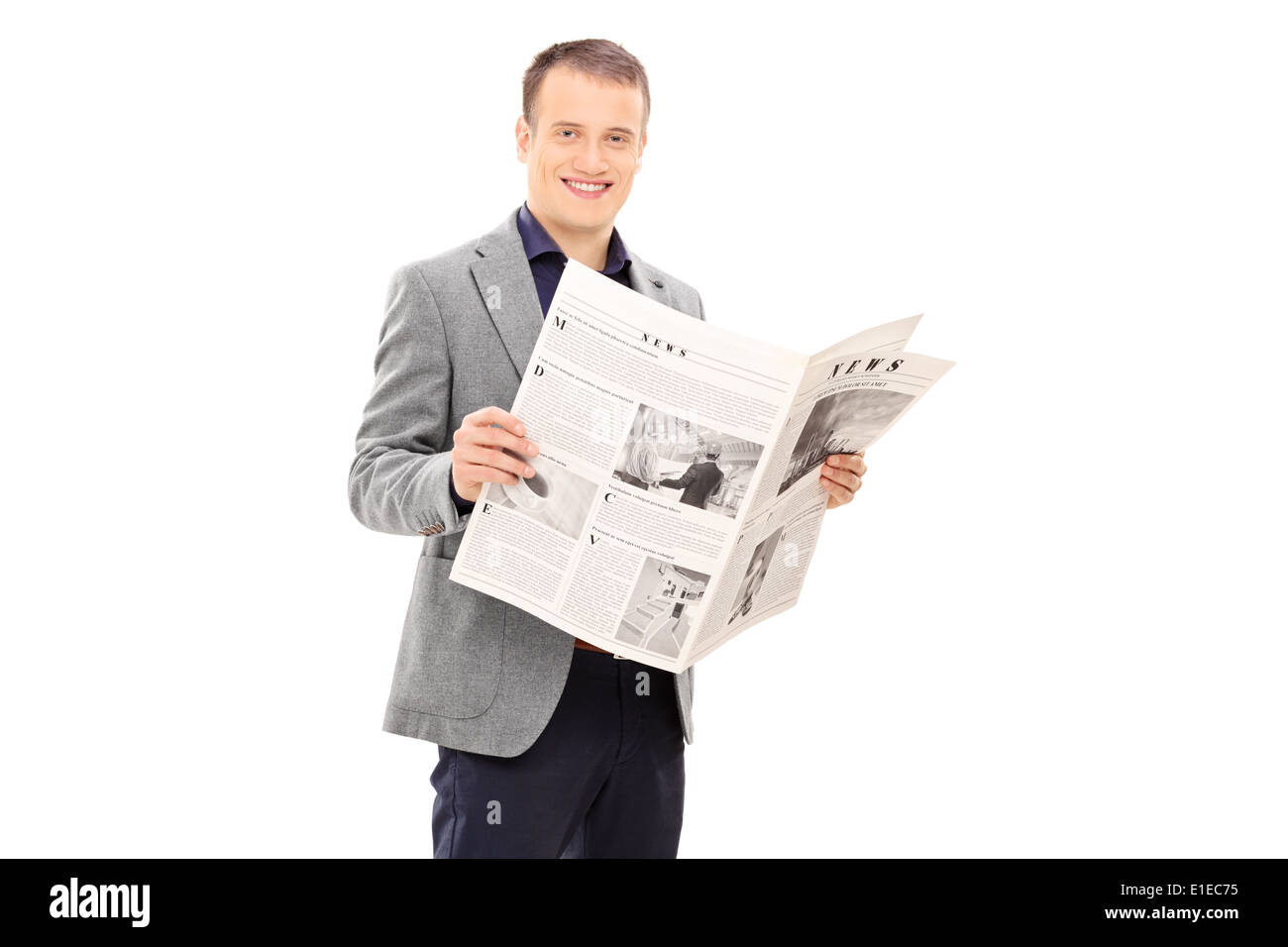 Elegant young man reading a newspaper Stock Photo - Alamy
