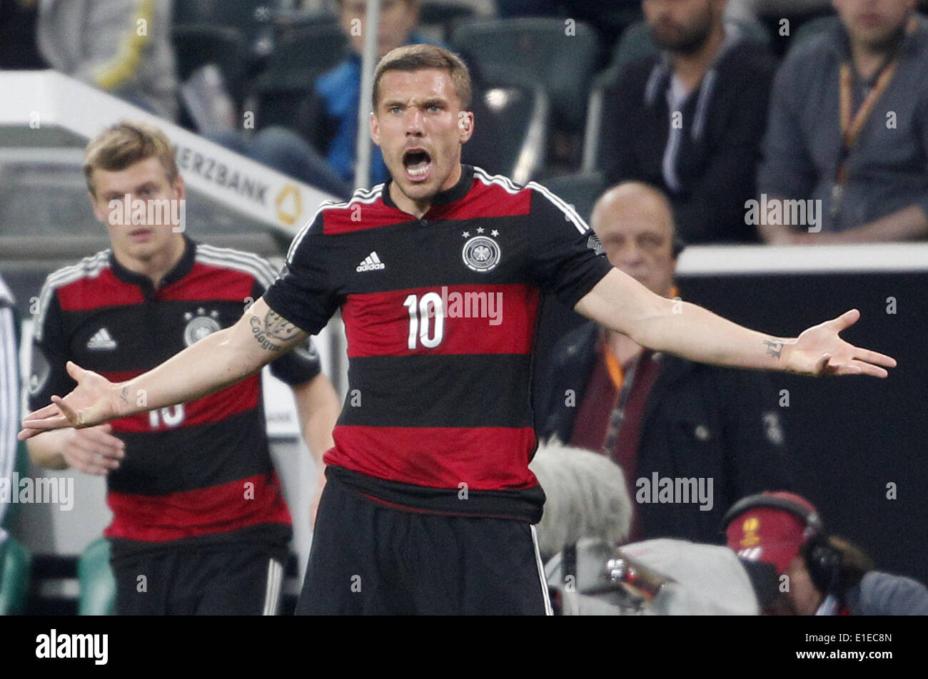 Moenchengladbach, Germany. 01st June, 2014. Germany's Lukas Podolski reacts during the friendly soccer match between Germany and Cameroon at the Borussia Park stadium in Moenchengladbach, Germany, 01 June 2014. Photo: Roland Weihrauch/dpa/Alamy Live News Stock Photo