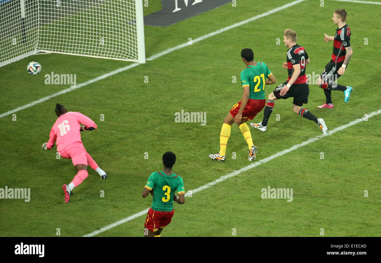 Moenchengladbach, Germany. 01st June, 2014. Germany's Andre Schuerrle (2-R) in action against Cameroon's Charles Itandje during the friendly soccer match between Germany and Cameroon at the Borussia Park stadium in Moenchengladbach, Germany, 01 June 2014. Photo: Rolf Vennenbernd/dpa/Alamy Live News Stock Photo
