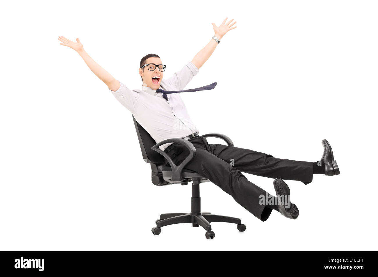 Man riding in an office chair and gesturing joy Stock Photo