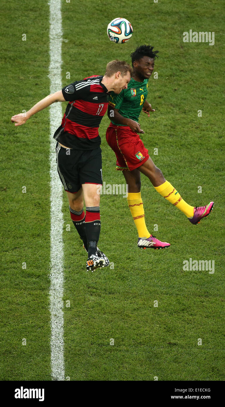 Germany's Per Mertesacker (L) in action against Cameroon's Benjamin Moukandjo during the friendly soccer match between Germany and Cameroon at the Borussia Park stadium in Moenchengladbach, Germany, 01 June 2014. Photo: Rolf Vennenbernd/dpa Stock Photo