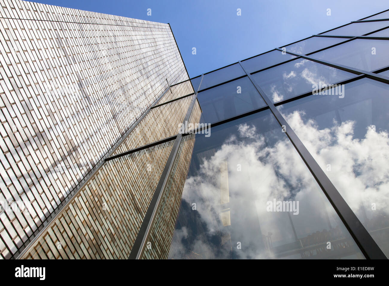modern office building with brick work and glass reflecting sky Stock ...
