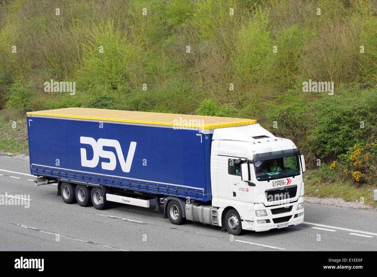 A Cargo Expert truck hauling Danish DSV trailer along the M20 motorway in Kent, England Stock Photo