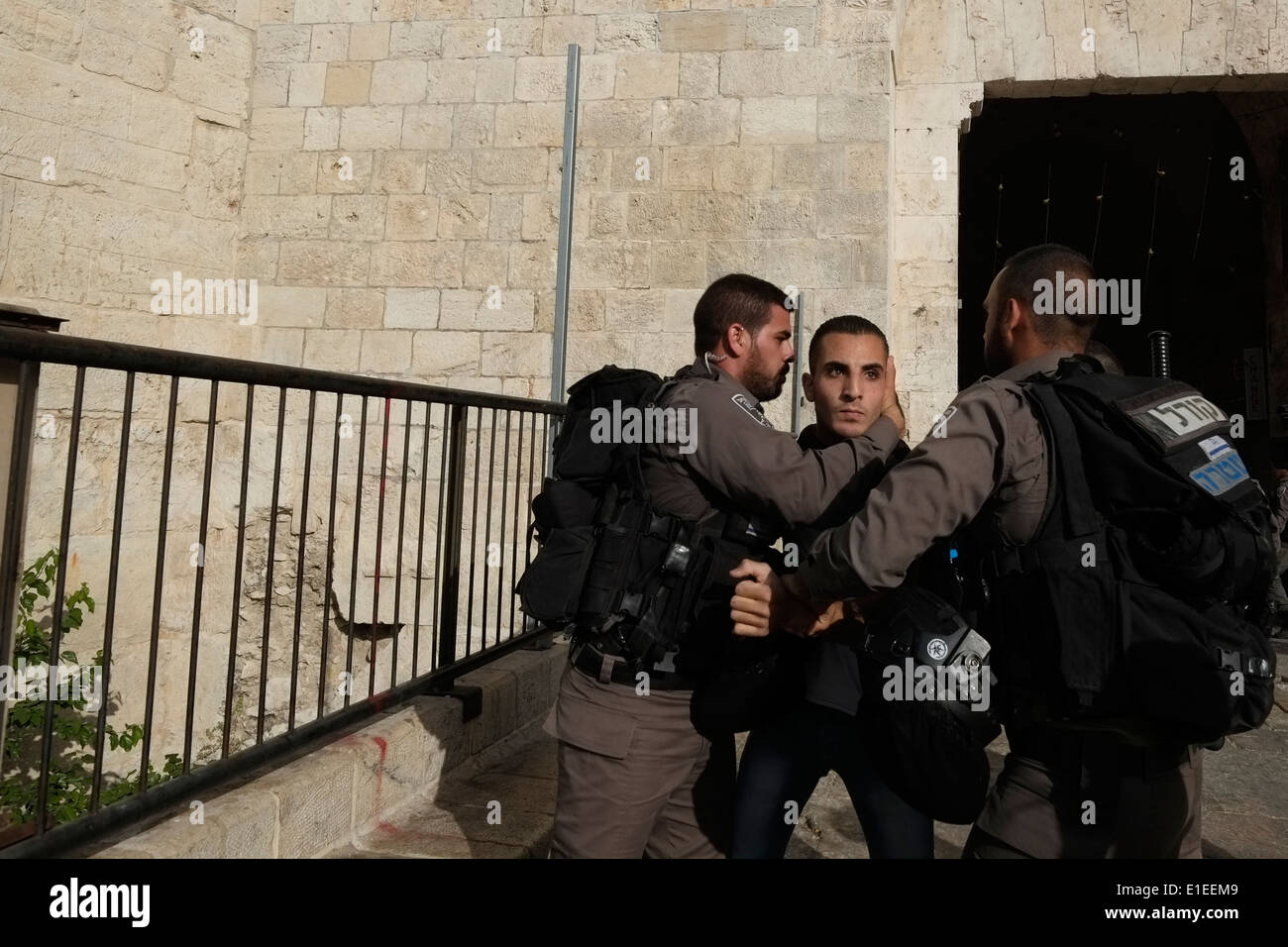 Israeli border police detain a Palestinian young man in Damascus gate old city Jerusalem Israel Stock Photo