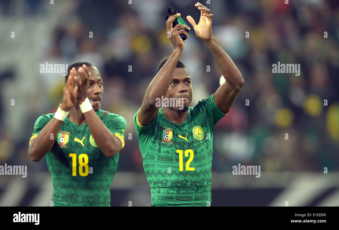 Moenchengladbach, Germany. 01st June, 2014. Cameroon's Enoh Eyong and Henri Bedimo (R) cheer after the friendly soccer match between Germany and Cameroon at the Borussia Park stadium in Moenchengladbach, Germany, 01 June 2014. Photo: Federico Gambarini/dpa/Alamy Live News Stock Photo