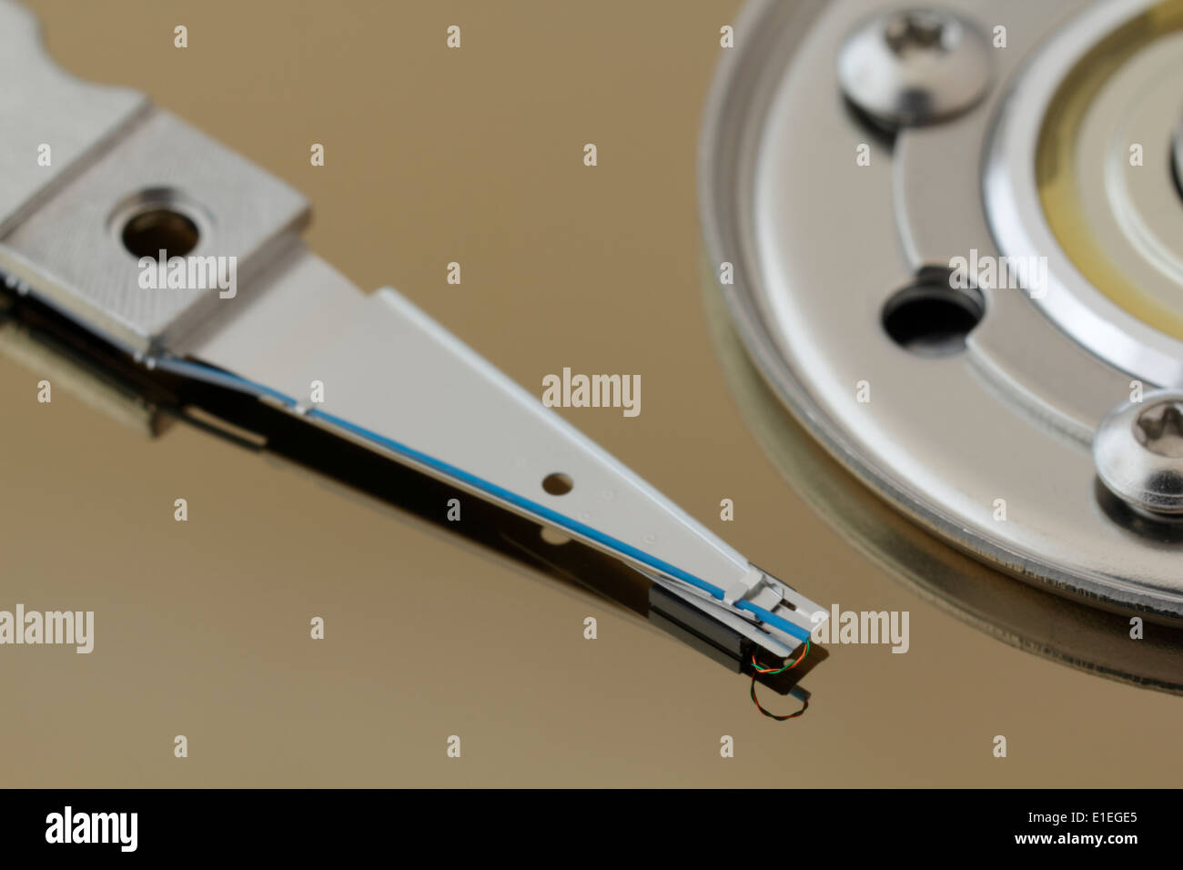 Close up detail of computer hard disk drive read head and hub. Focus on data read/write head. Stock Photo