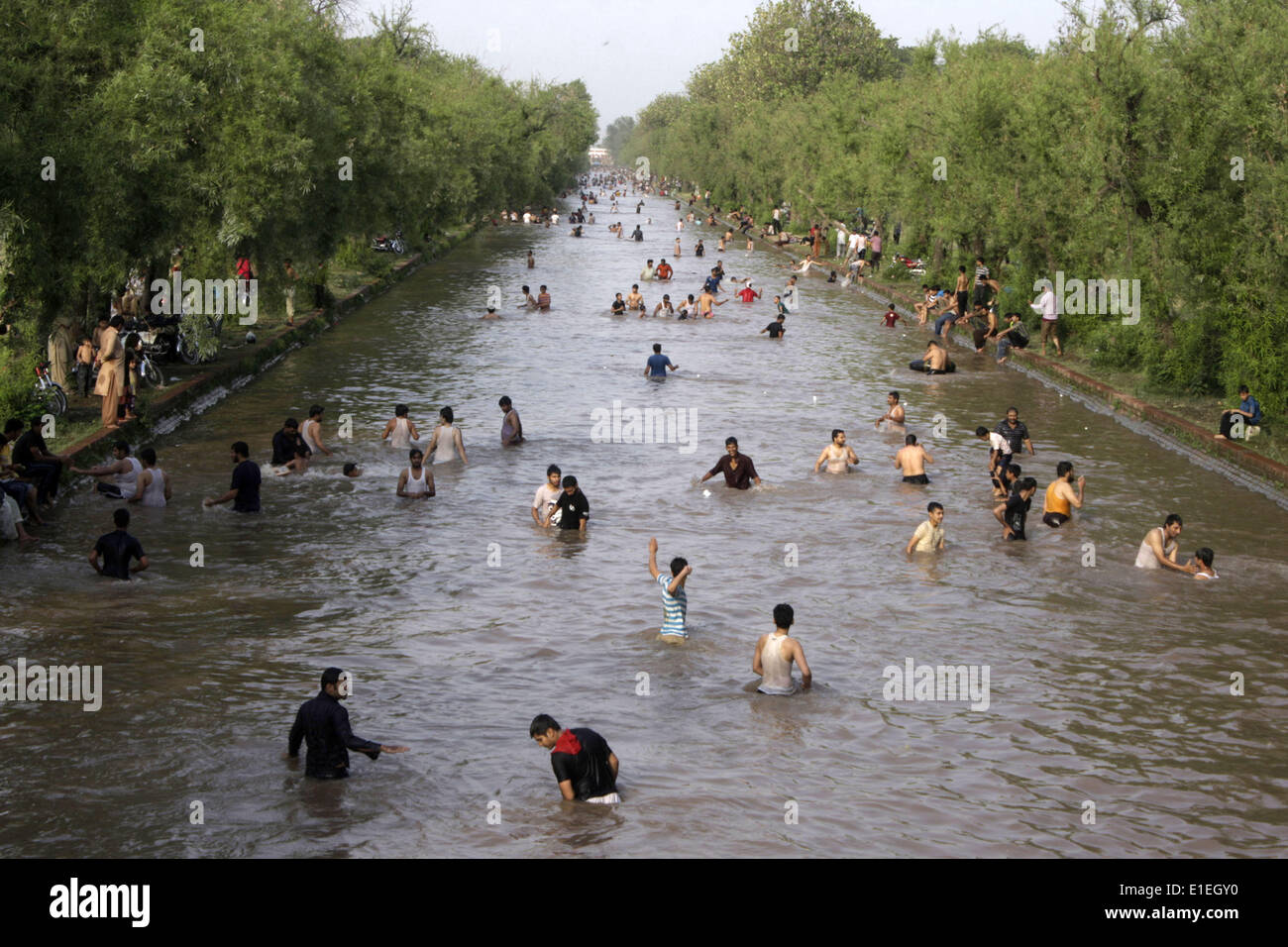 Lahore. 2nd June, 2014. People swim in a canal to beat the heat as temperature rises over 40 degrees Celsius in eastern Pakistan's Lahore on June 2, 2014. © Jamil Ahmed/Xinhua/Alamy Live News Stock Photo