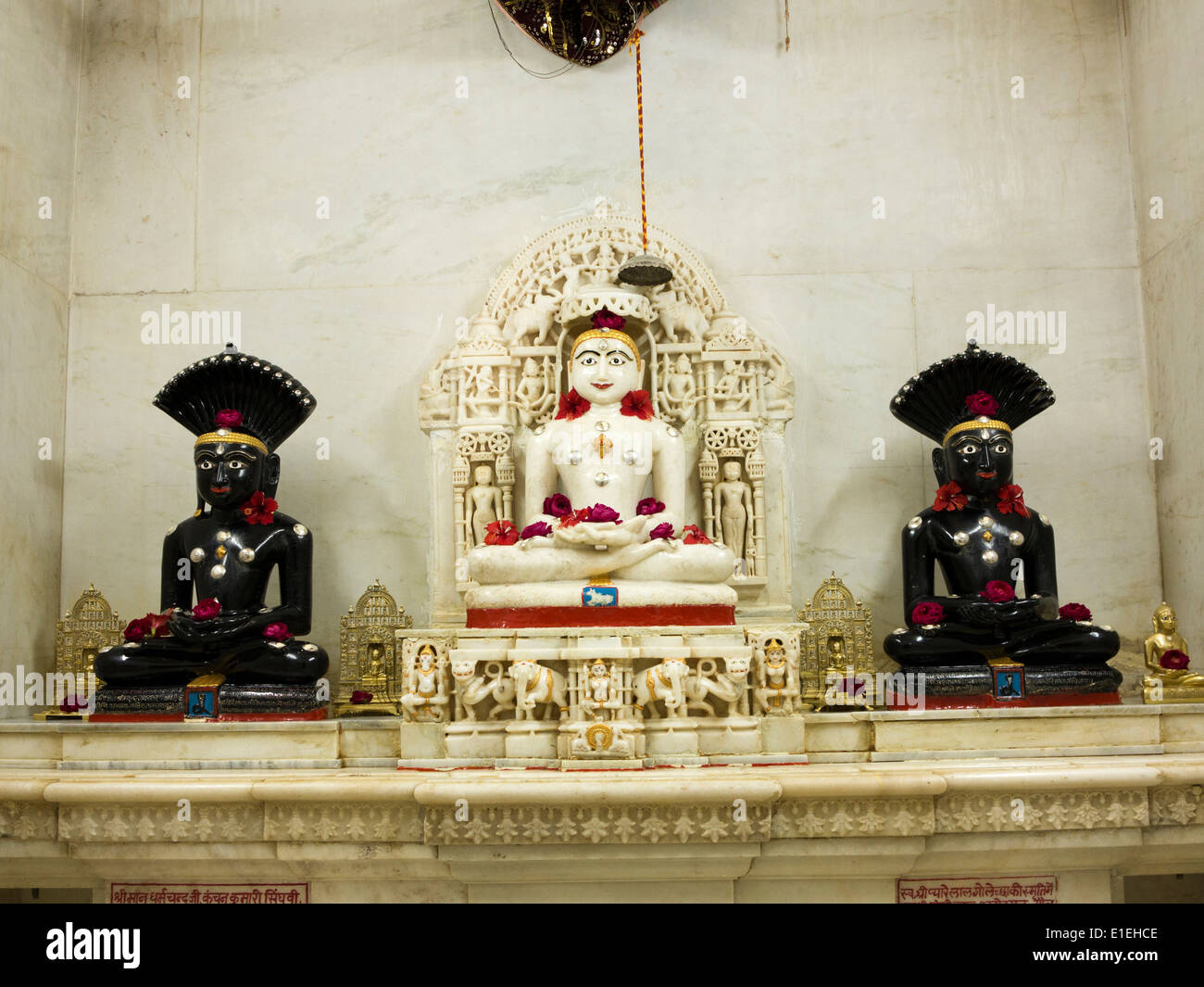 India, Rajasthan, Jaisalmer, Amar Sagar Jain temple, Lord Mahavir Mahavira statue with Sri Parshwanath statues Stock Photo
