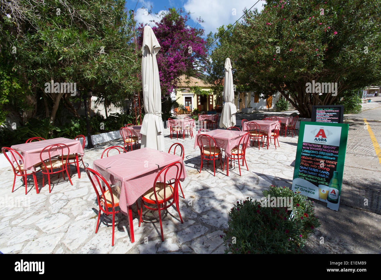 Village of Assos, Kefalonia. Picturesque view of an empty restaurant in the village of Assos. Stock Photo
