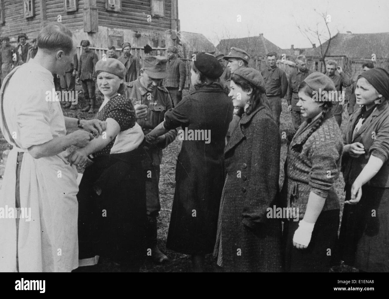 The picture from a Nazi news report shows the vaccination of civilians capable of working in the German occupied areas along the Eastern Front in May 1942. The original text on the back of the picture reads. 'Prevention is better than curing. Even the civilians are vaccinated to prevent any chance of a disease outbreak. Natja is very afraid.' Fotoarchiv für Zeitgeschichtee - NO WIRE SERVICE Stock Photo