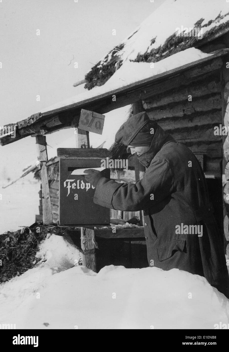The picture from a Nazi news report shows a German soldier putting a letter into a mailbox at the field post office on the Eastern Front in 1942. Fotoarchiv für Zeitgeschichtee - NO WIRE SERVICE Stock Photo