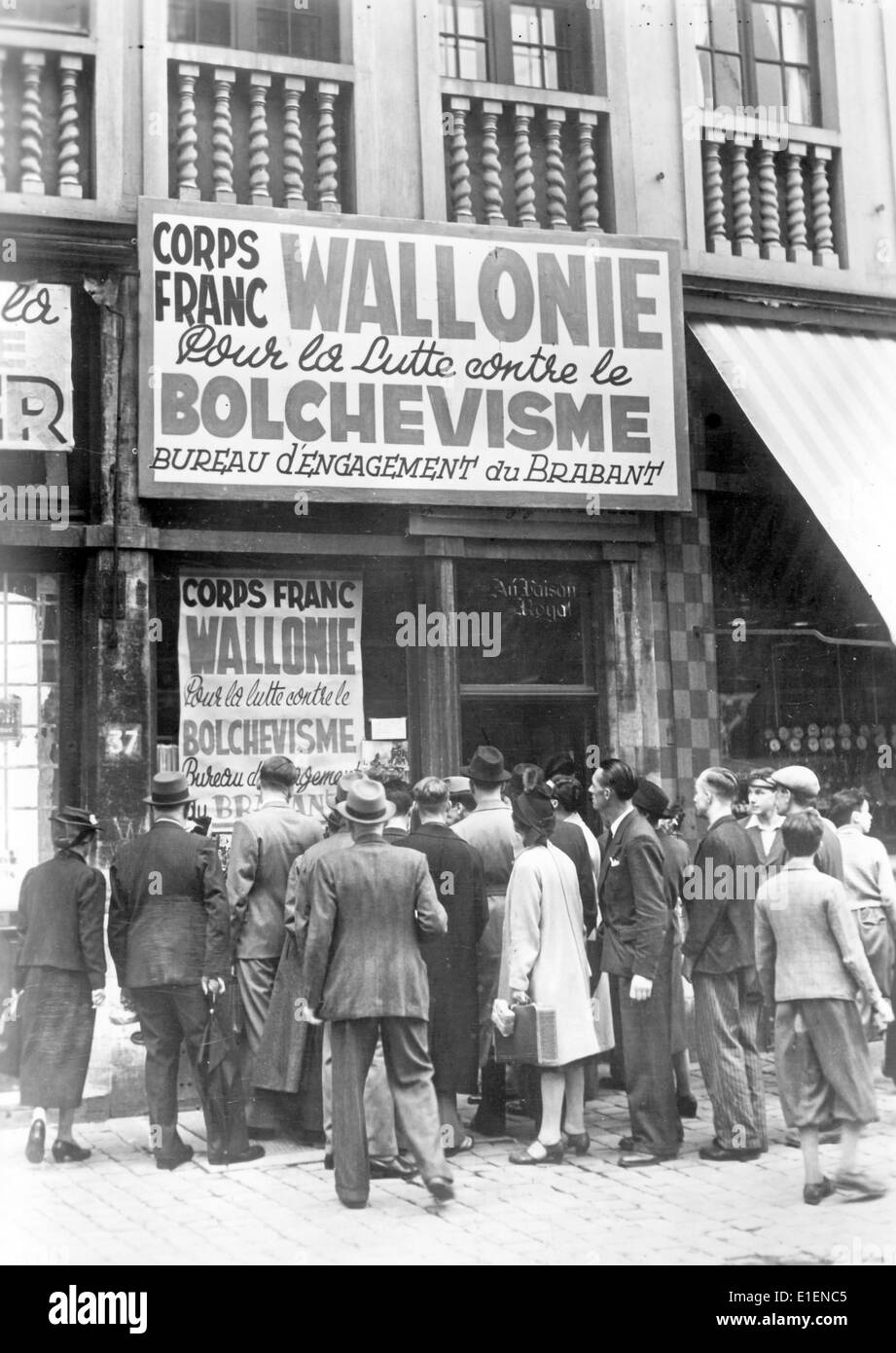 The picture from a Nazi news report shows a crown of people outside of office recruiting Walloon men for the German Waffen-SS for the 'fight against Bolshevism' along the Eastern Front in Brussels, July 1941. Fotoarchiv für Zeitgeschichtee - NO WIRE SERVICE Stock Photo