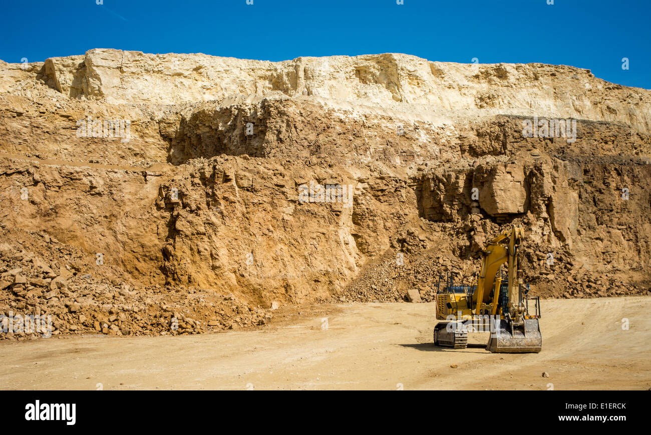 Excavator at quarry mining site Stock Photo - Alamy