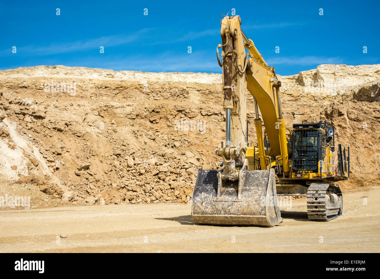 Excavator at quarry mining site Stock Photo Alamy