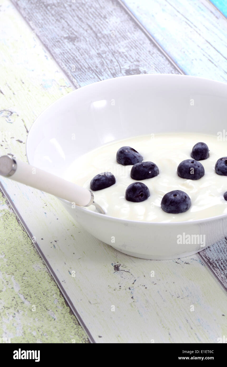 Fresh natural Yogurt with blueberries in a bowl Stock Photo