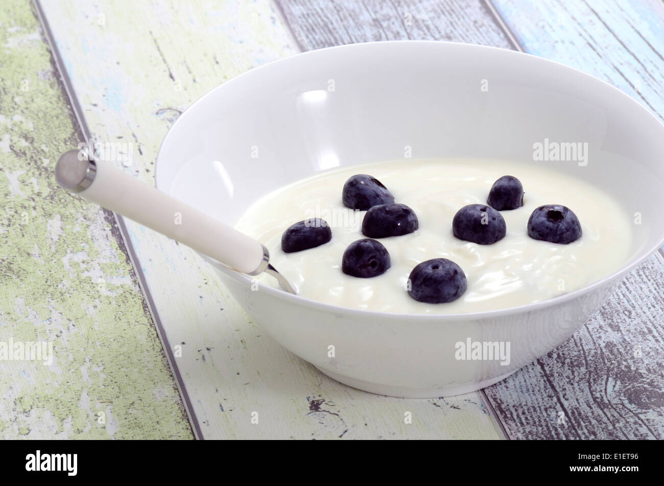 Fresh natural Yogurt with blueberries in a bowl Stock Photo