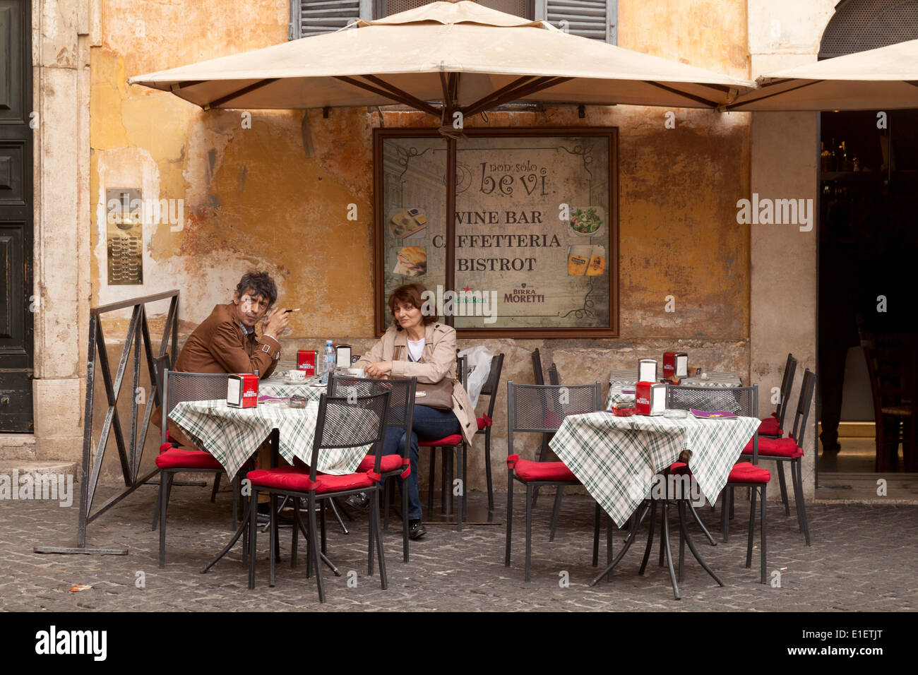 Rome cafe a local middle aged couple having a morning cup of coffee