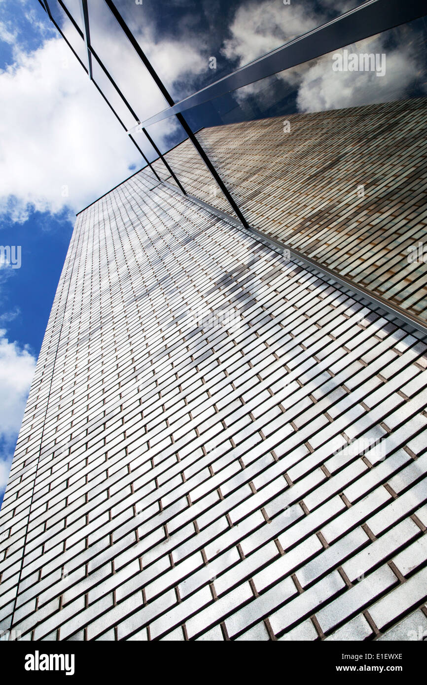 modern office building with brick work and glass reflecting sky Stock ...
