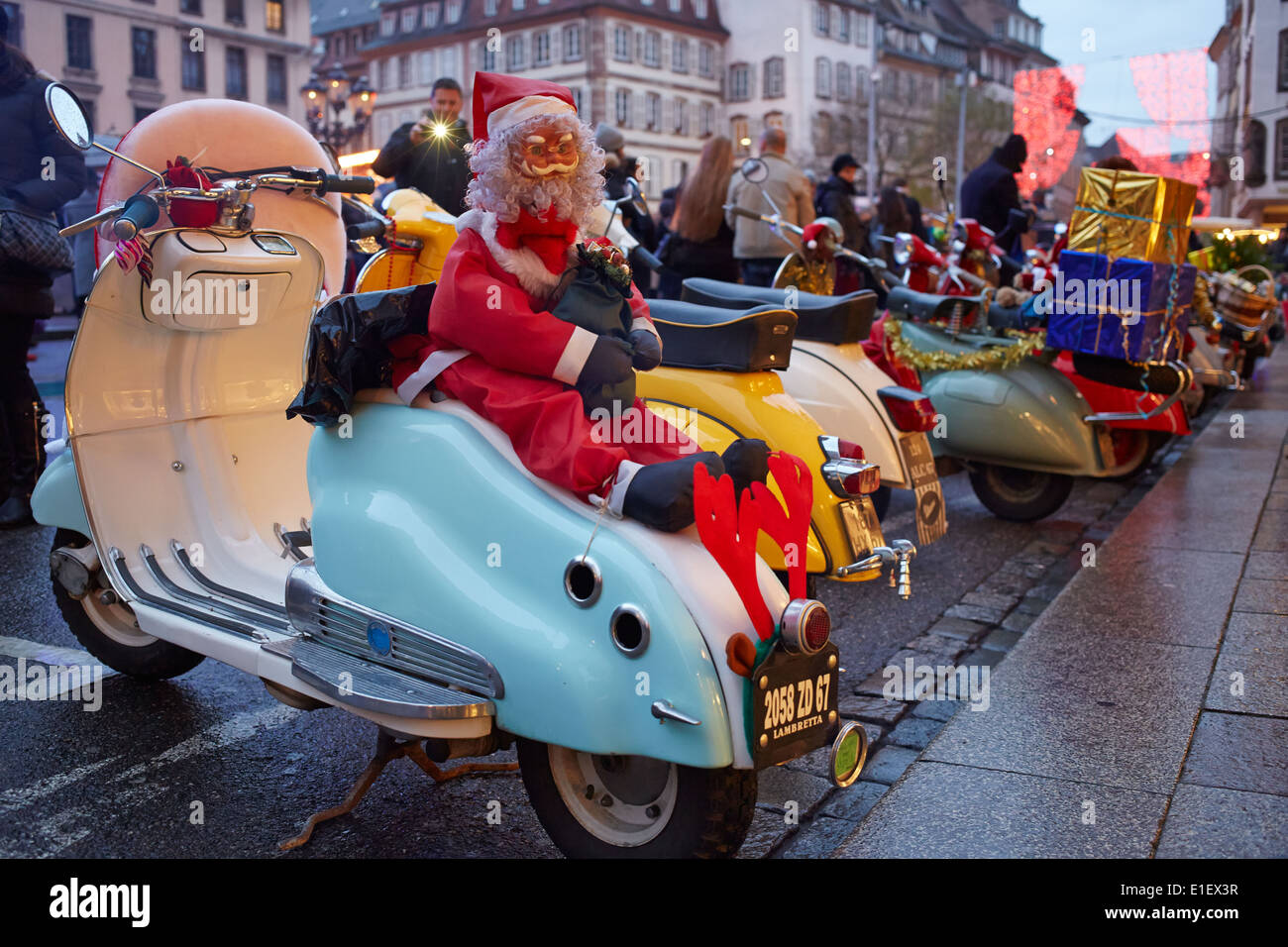 Motor scooter with Santa Claus sitting on top Stock Photo
