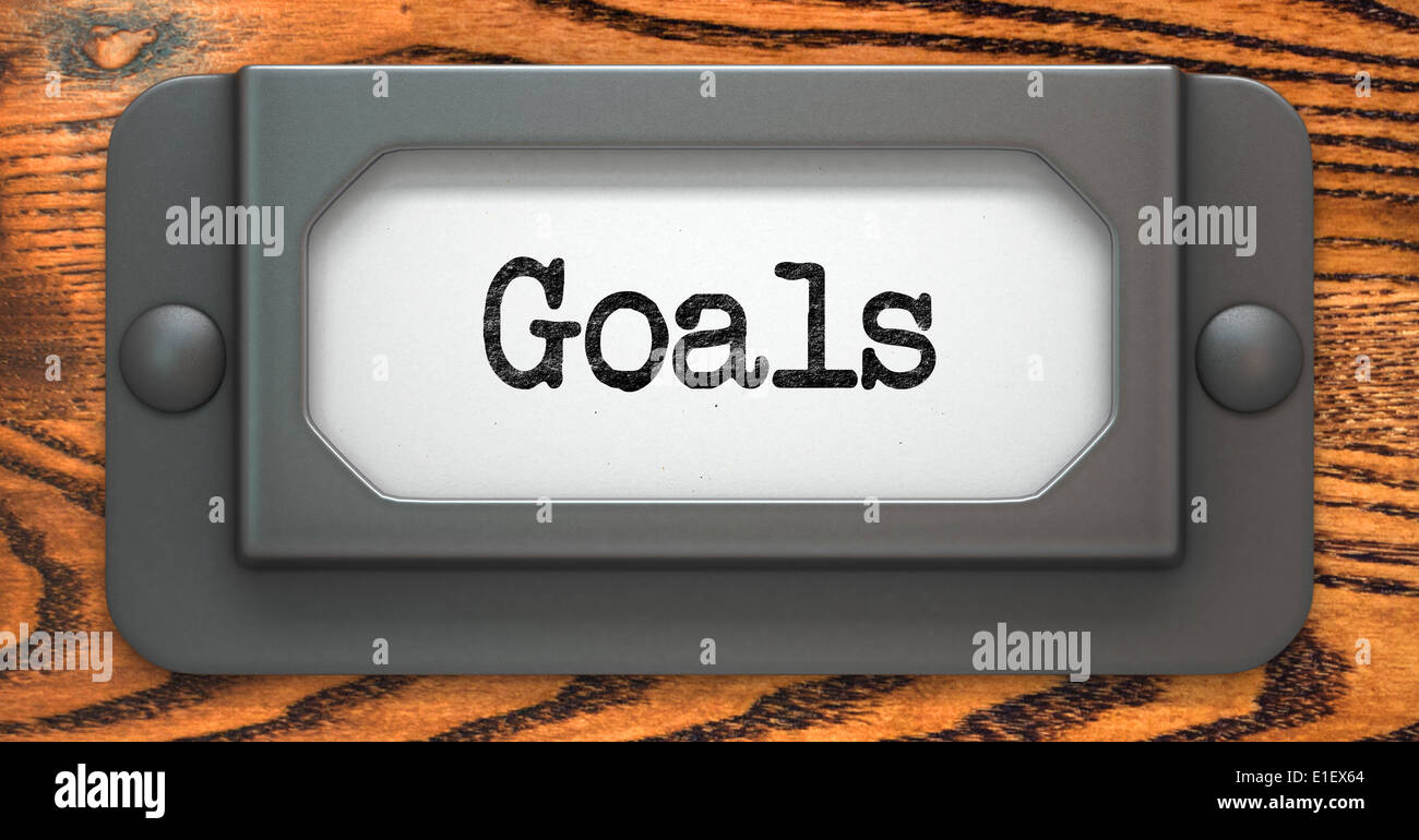 Goals - Inscription on File Drawer Label on a Wooden Background. Stock Photo