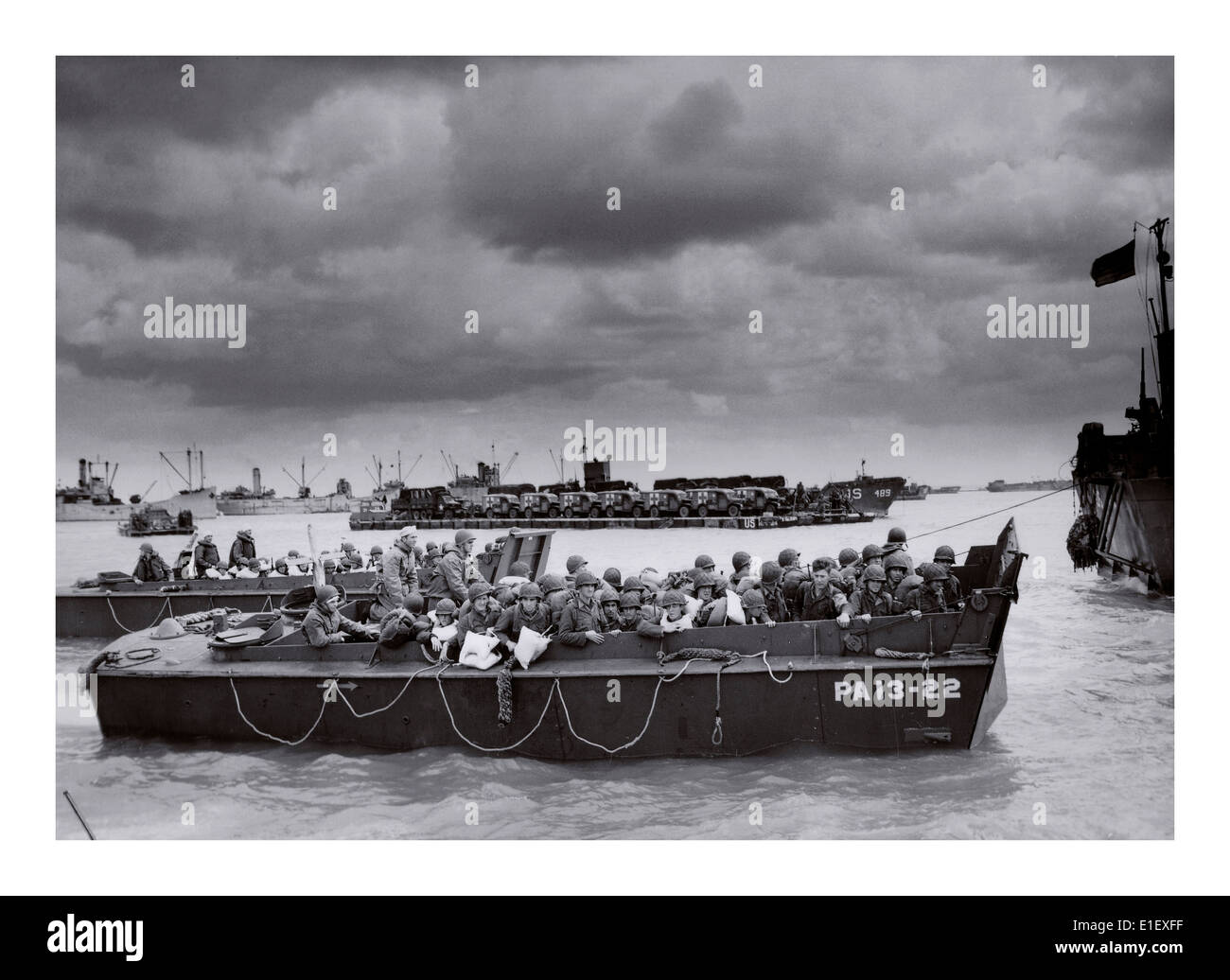 D-Day Omaha invasion, American troops in beach landing craft under dark skies Normandy France 6th June 1944 Stock Photo