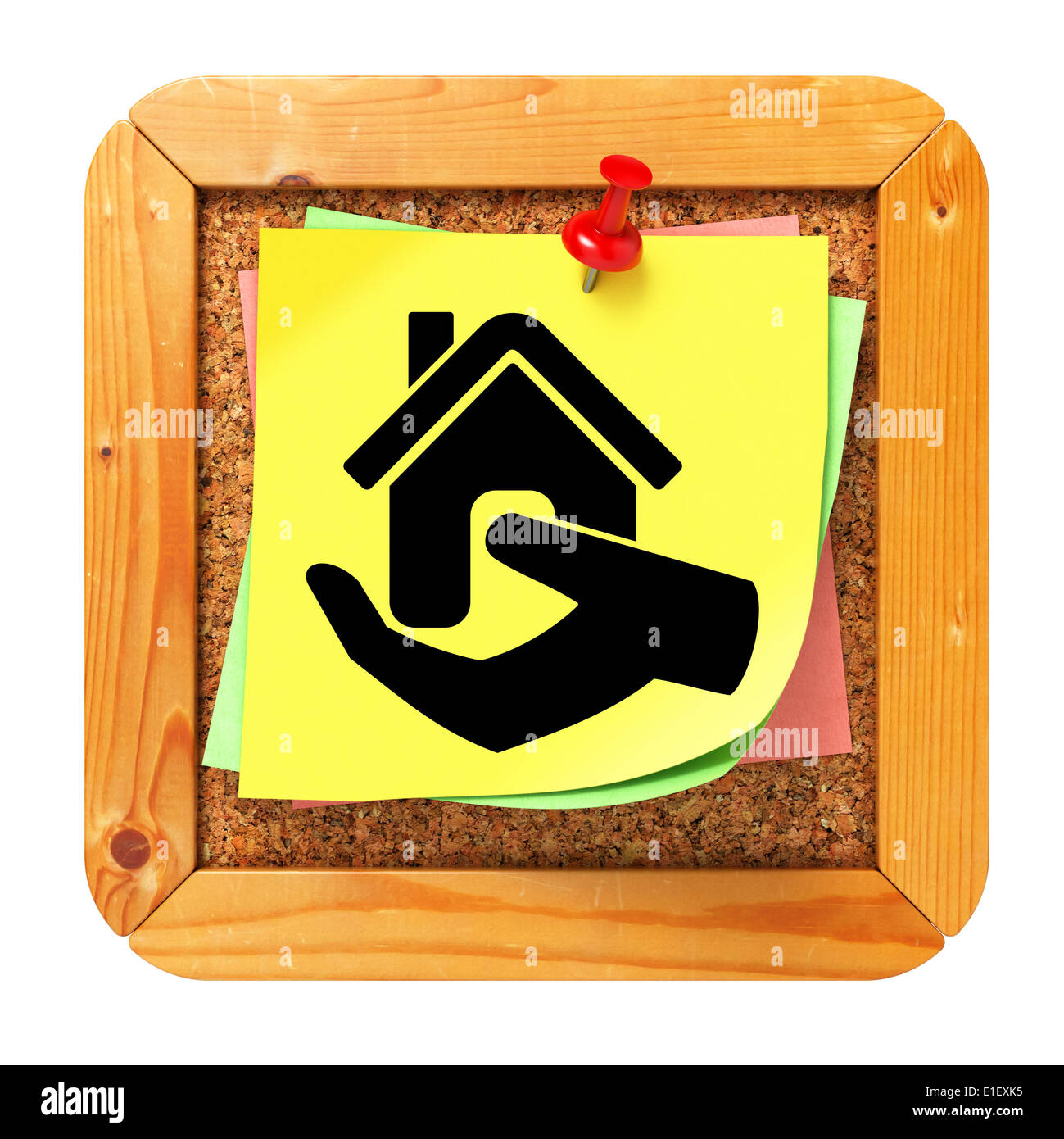 Icon Home in Hand at Yellow Sticker on Cork Message Board. Stock Photo