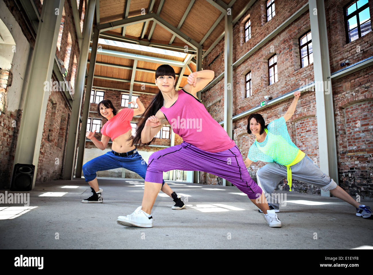 group of women in sport dress dancing aerobics dance called zumba Stock Photo
