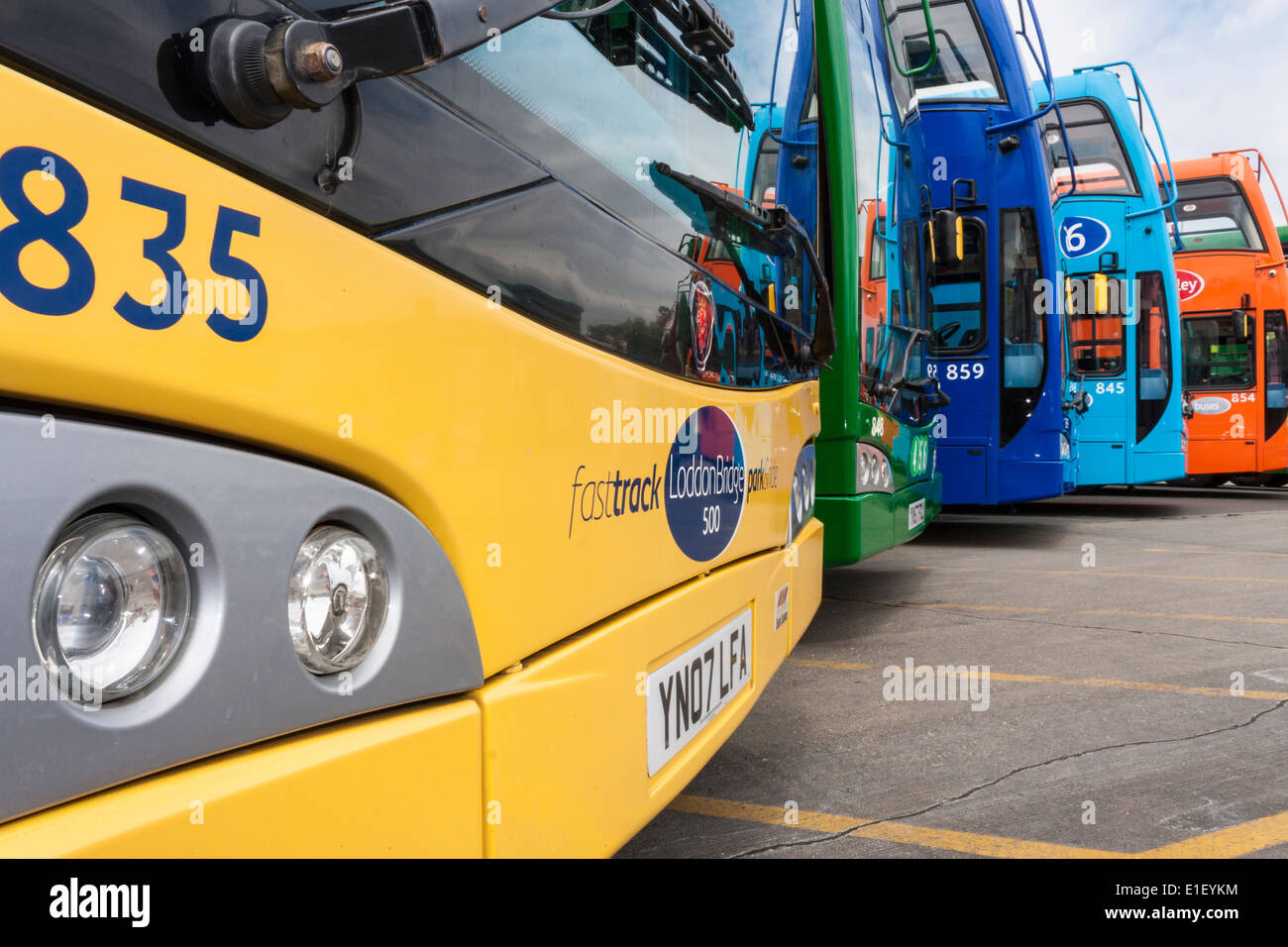 Many multicoloured buses in a line. Reading, Berkshire, England, GB, UK. Stock Photo