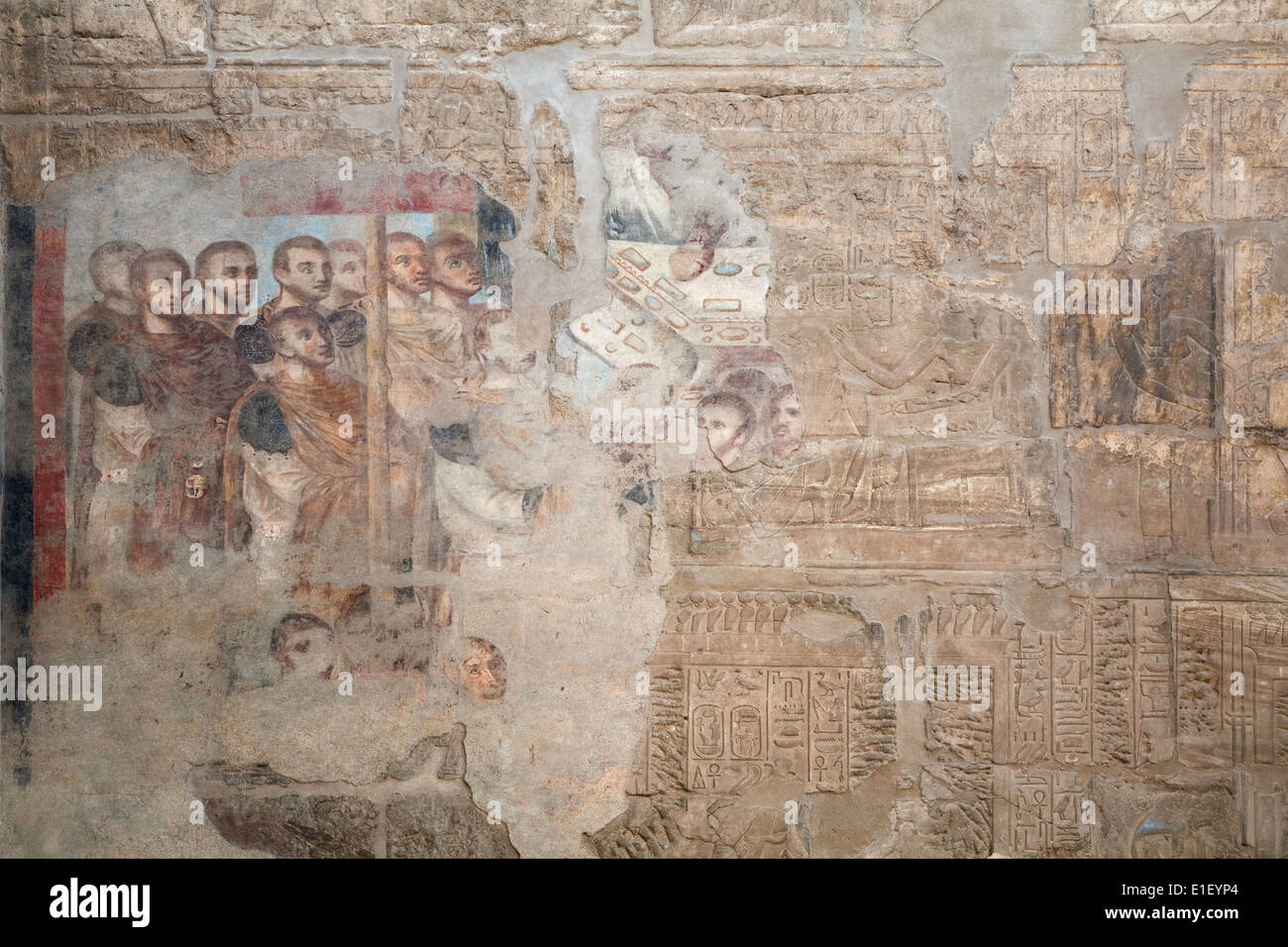 Christian mural covering ancient Egyptian relief in Karnak, Egypt Stock Photo