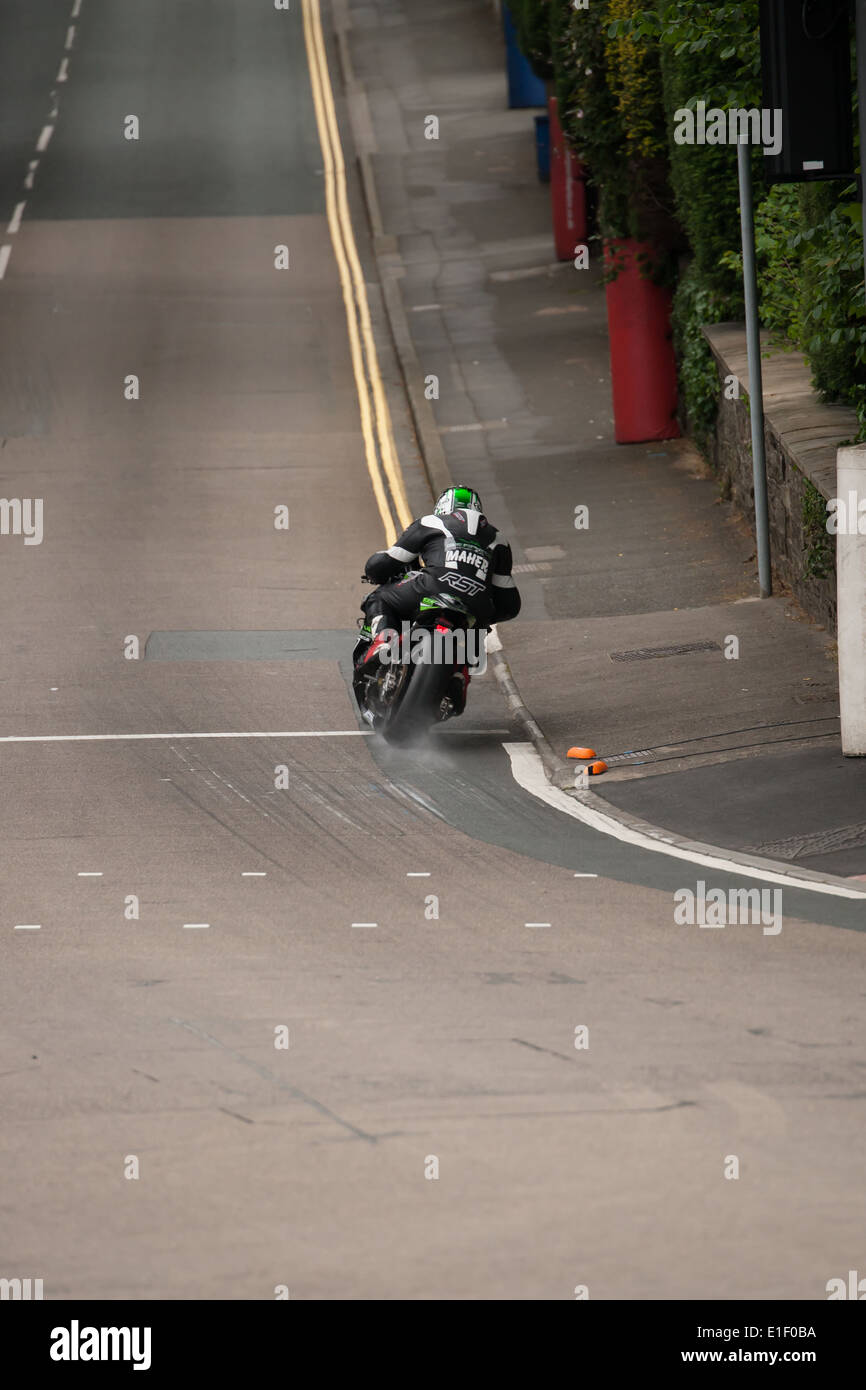 A competitor tackles the infamous Bray Hill corner during the 2014 IOM TT practice week Stock Photo
