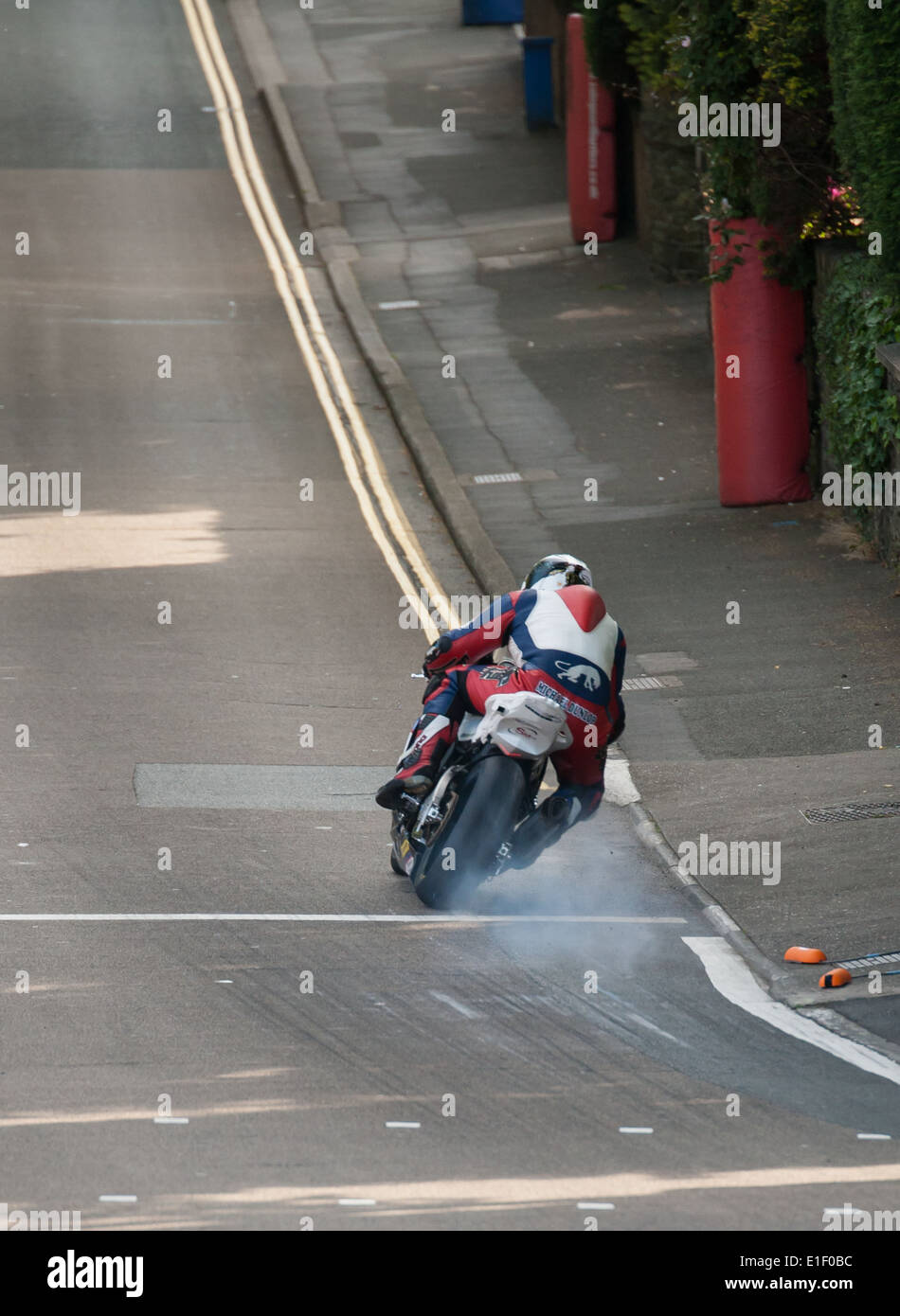 Michael Dunlop's Hawk Racing prepared BMW bottoms out at the bottom of Bray Hill during IOM TT 2014 practice week. Stock Photo