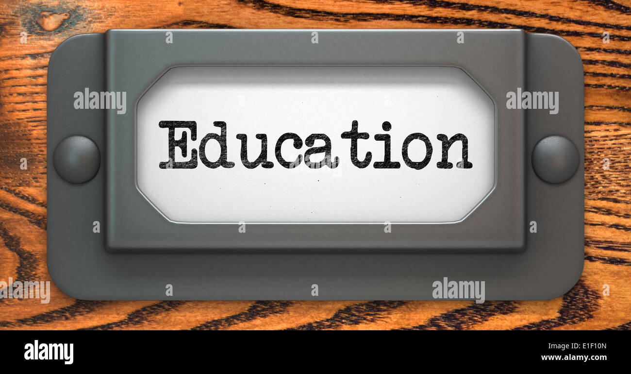 Education - Inscription on File Drawer Label on a Wooden Background. Stock Photo