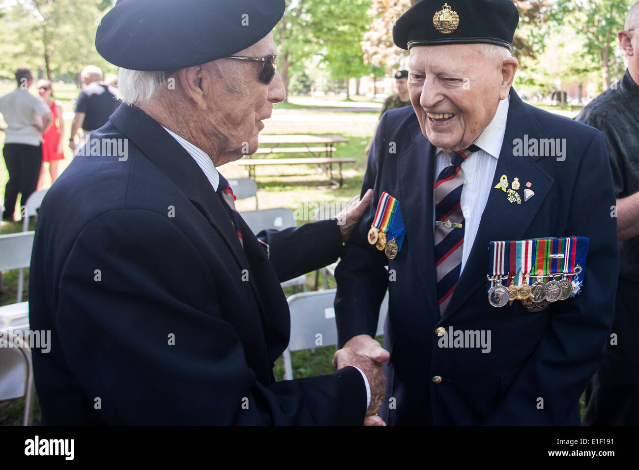 London, Ontario, Canada. 1st June 2014. Active and veteran members of the Canadian Army's 1st Hussars parade through London Ontario, Canada on June 1, 2014 to commerate the 70th Anniversary of D-Day. The 1st Hussars landed on Juno Beach in Normandy France as part of operation Overload. Each year the still active military unit marches to Victoria Park where a Sherman Tank named 'Holly Roller' is on display. The tank orginally from London was part of the D-Day landing and was eventually returned to its home. Credit:  Mark Spowart/Alamy Live News Stock Photo