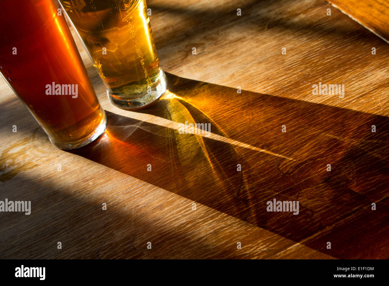 Two pints in a pub on a beautiful sunny day Stock Photo