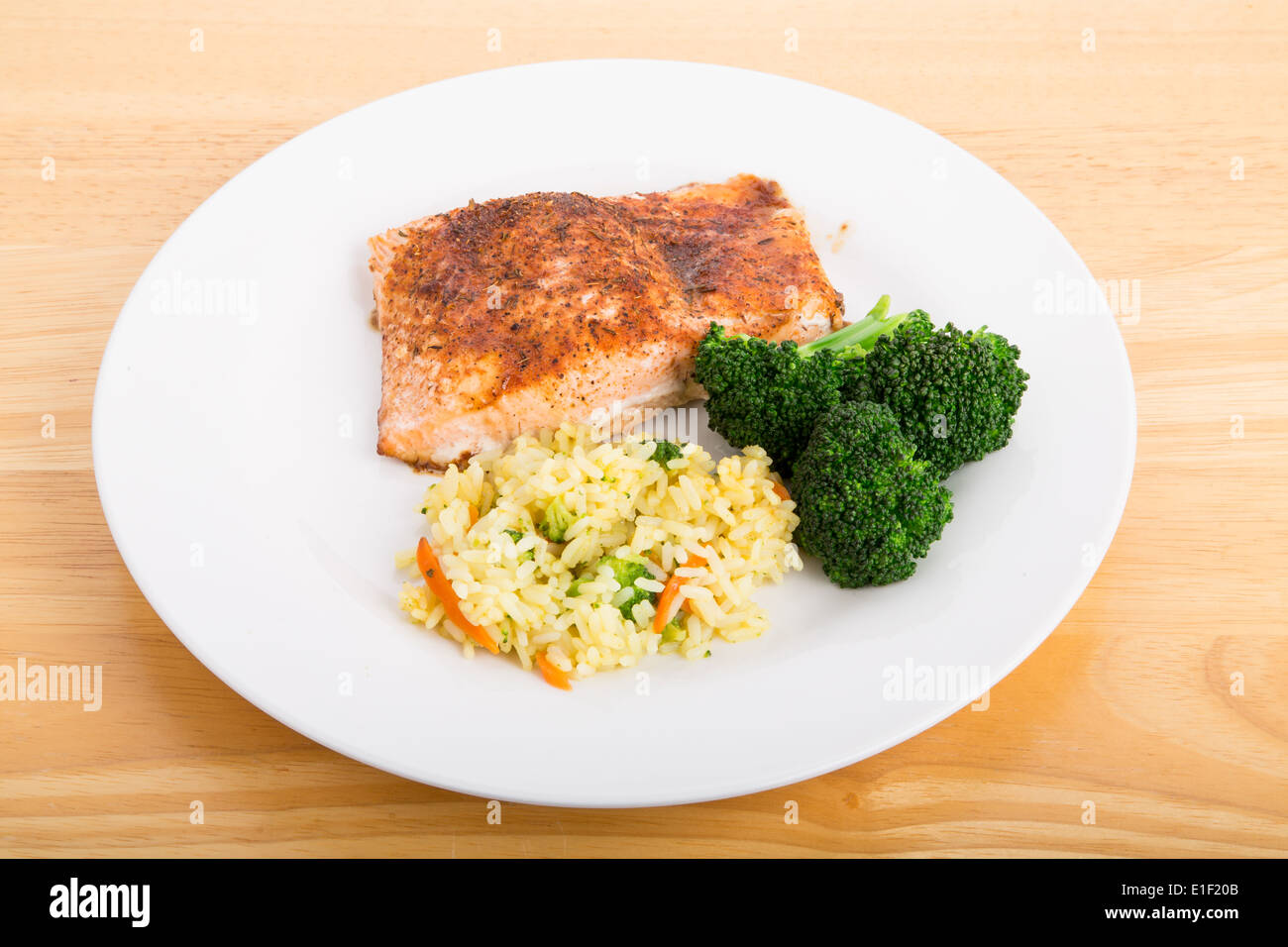 Baked Salmon Fillet with Steamed Broccoli and Rice Pilaf Stock Photo