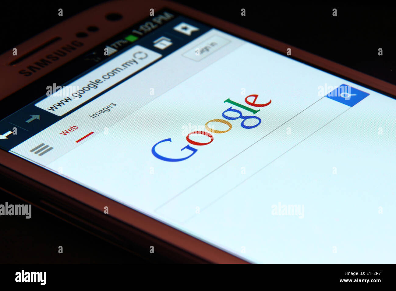 Google website on smartphone screen. Google Inc. is an American multinational corporation
