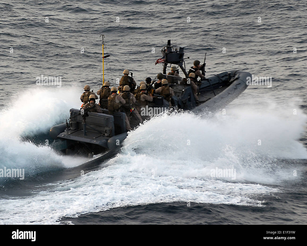 U.S. Marines assigned to the 15th Marine Expeditionary Unit?s Maritime Raid Force approach the motor vessel Magellan Star in th Stock Photo