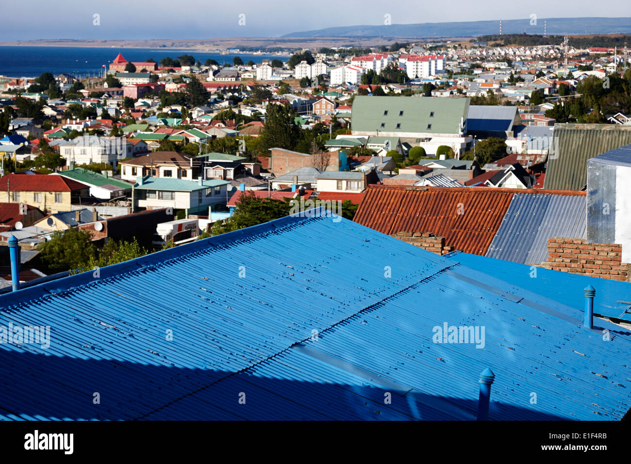 looking down over corrugated iron roofs from la cruz viewpoint in Punta Arenas Chile Stock Photo