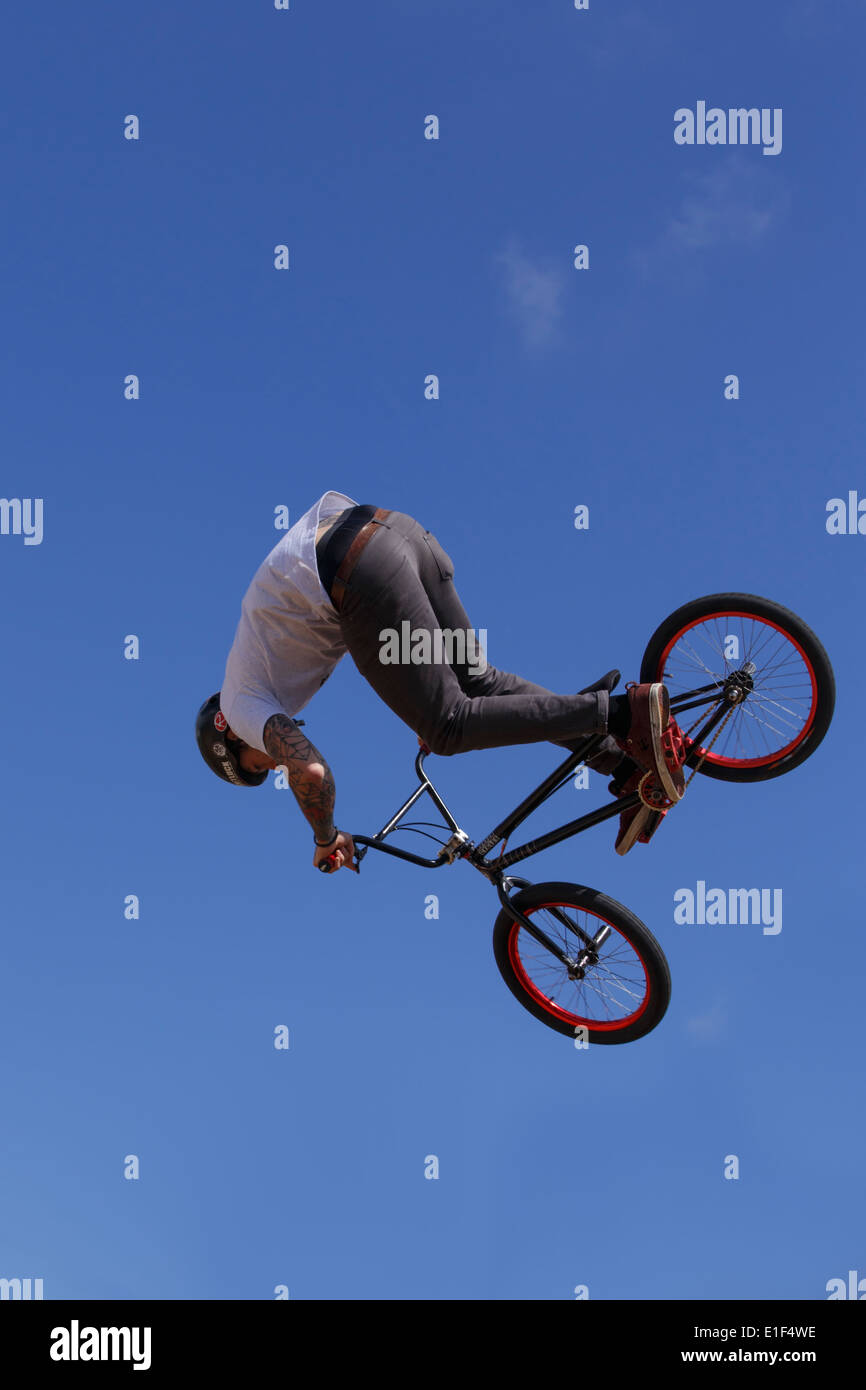 BMX stunt rider in full flight. Stock Photo
