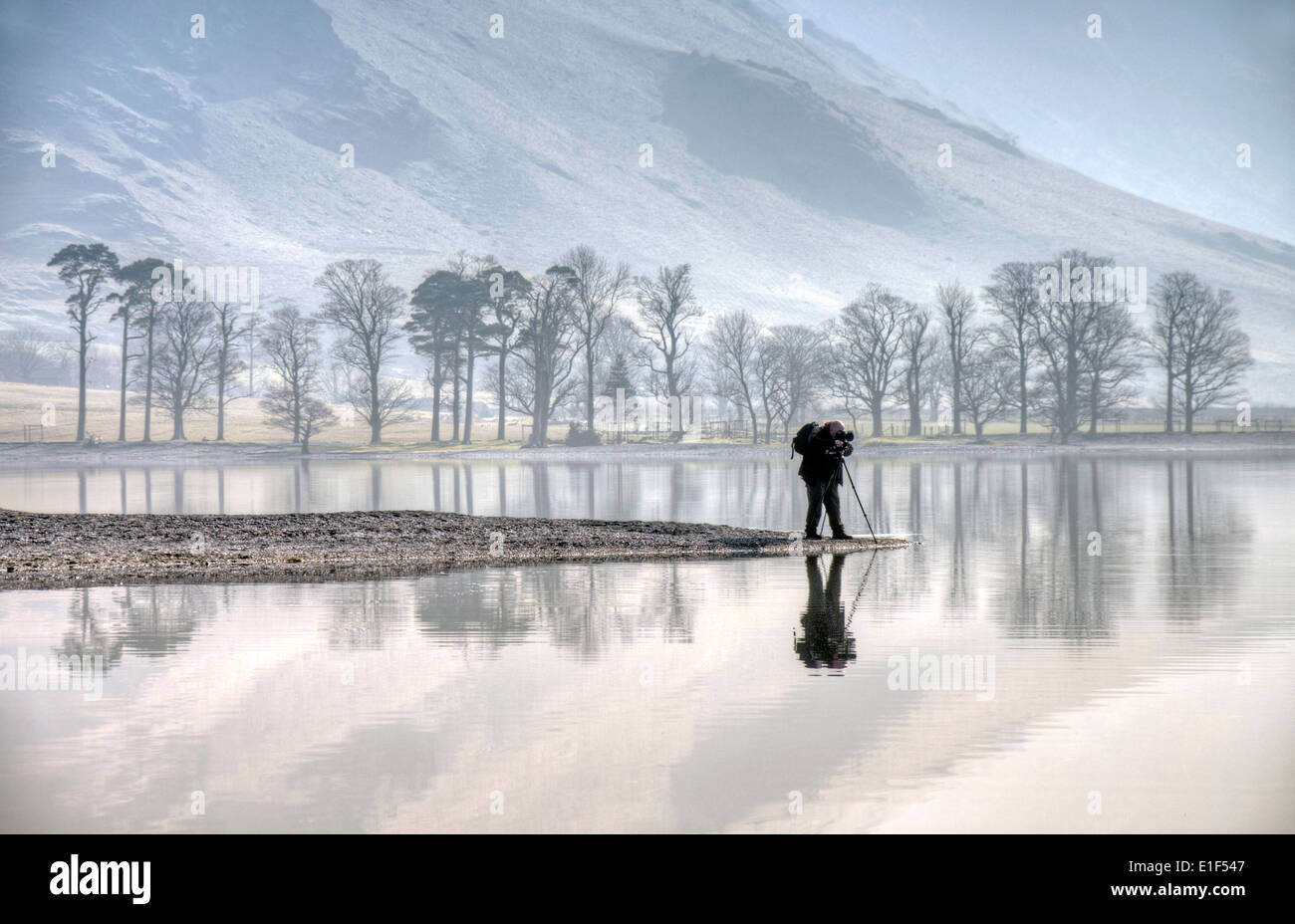A photographer at Buttermere in the Lake District, Cumbria England UK Stock Photo