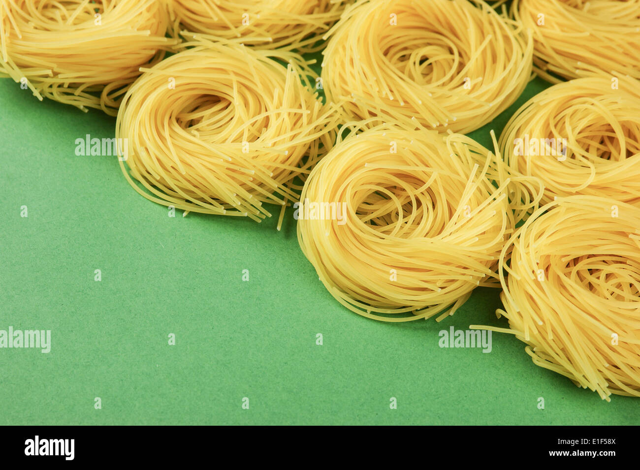 Tagliatelle pasta background on the green background Stock Photo Alamy