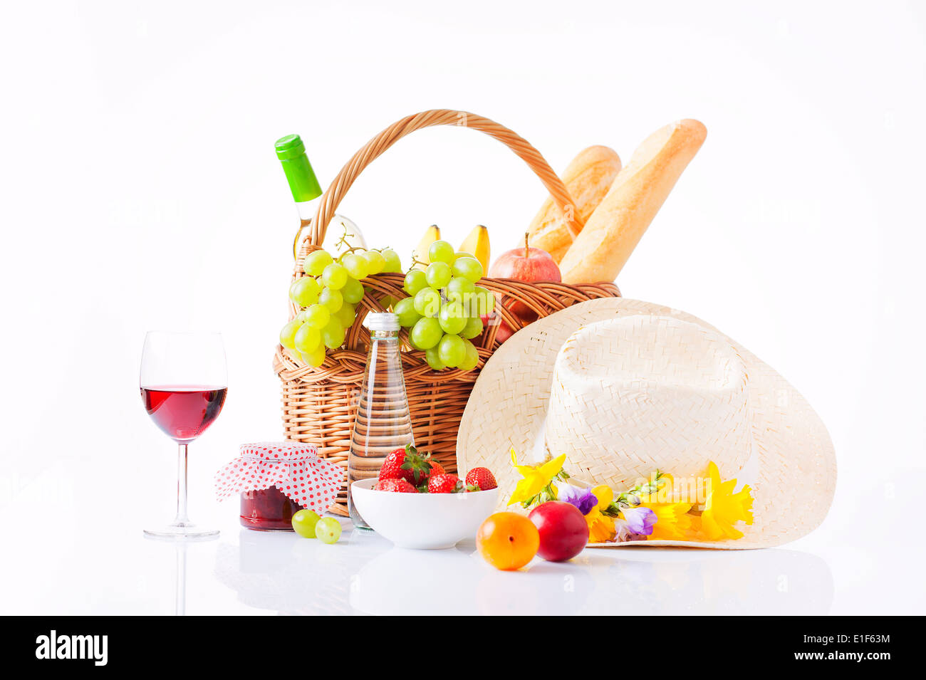 picnic basket with wine, fruit and bread Stock Photo - Alamy